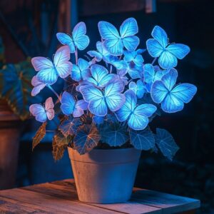 Begonia Moonlight Butterfly plant with glowing blue neon leaves shaped like butterflies in a ceramic pot.