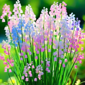 Lily of the Valley plant with multicolored pink, blue, and white bell-shaped flowers in a green garden