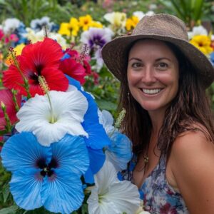 Smiling Woman with Colorful Hibiscus Flowers